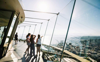 Visitors enjoying the view from the Space Needle observation deck in Seattle.