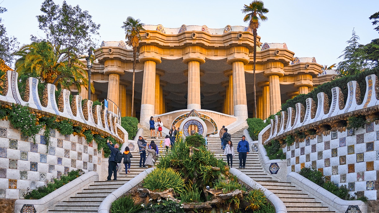 Park Güell mosaic benches with Sagrada Familia in the background, Barcelona.