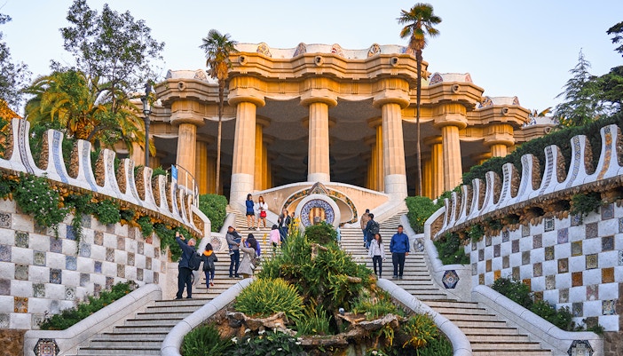 Park Güell mosaic benches with Sagrada Familia in the background, Barcelona.