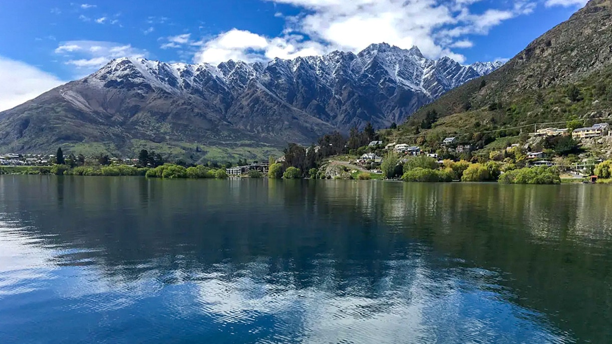 Lake Wakatipu boat cruise with scenic mountain views, Queenstown, New Zealand.
