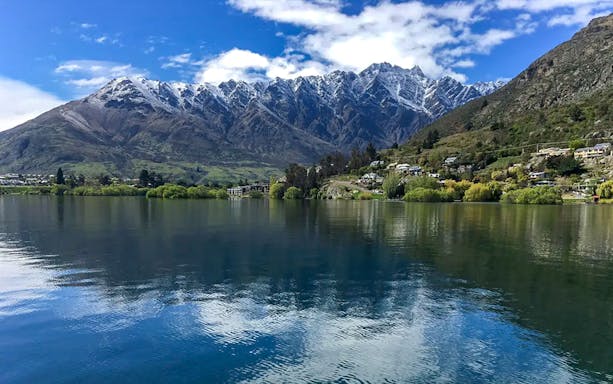 Lake Wakatipu boat cruise with scenic mountain views, Queenstown, New Zealand.