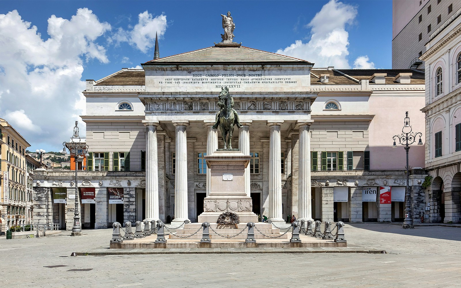 Teatro Carlo Felice in Genoa with illuminated facade at night.