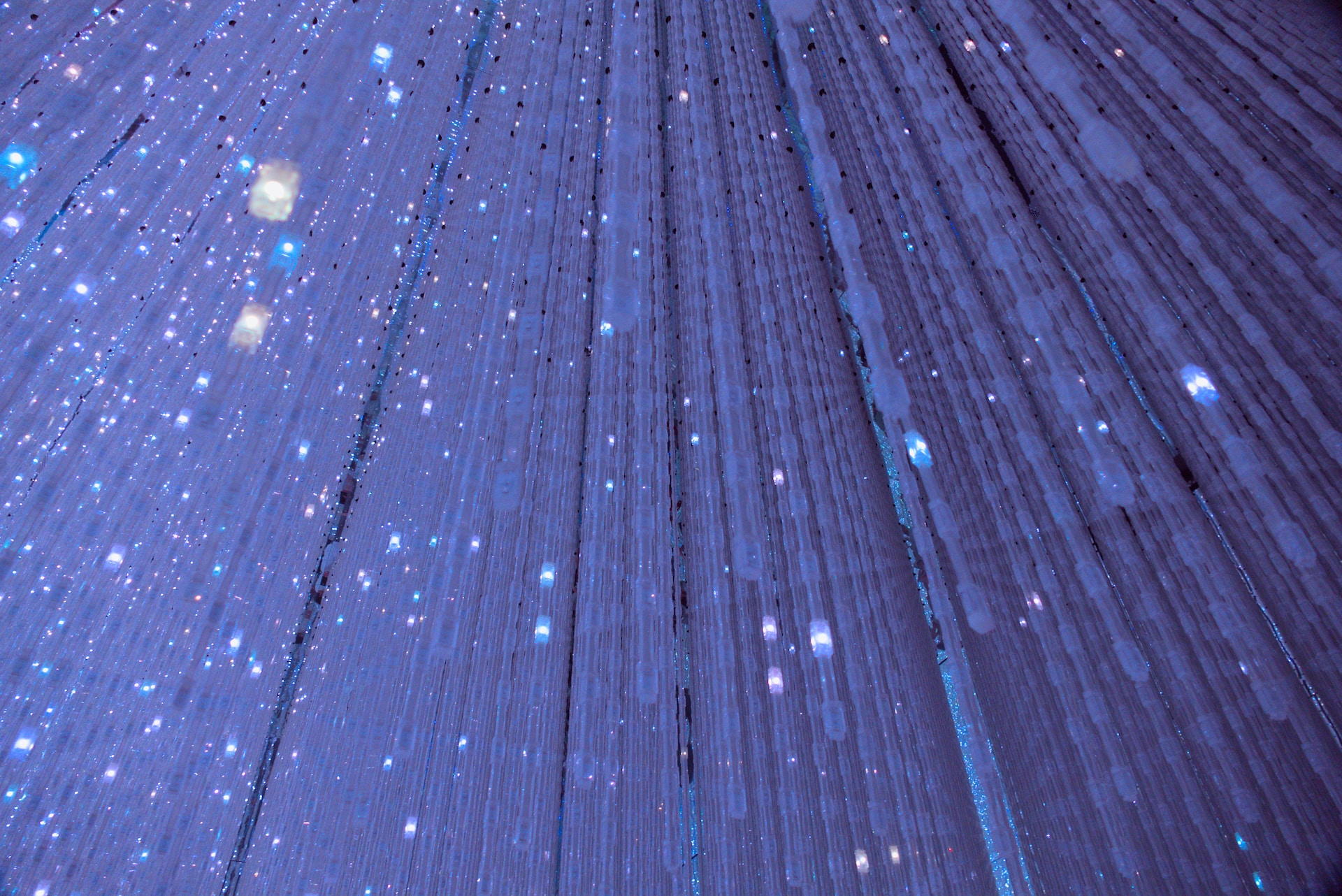 TeamLab Planets Tokyo immersive digital art installation with colorful light projections.