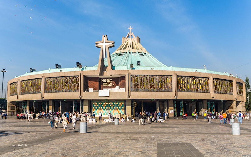 Basilica of Guadalupe exterior with visitors in Mexico City.