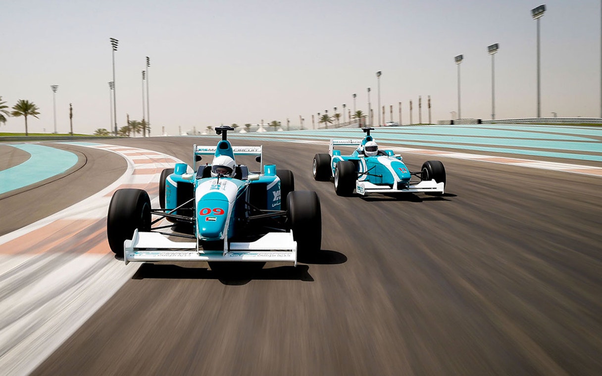 Race cars on a track at high speed, Yas Marina Circuit, Abu Dhabi.