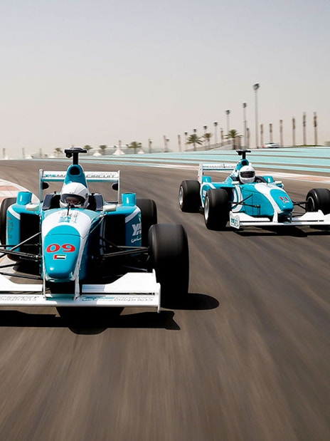 Race cars on a track at high speed, Yas Marina Circuit, Abu Dhabi.