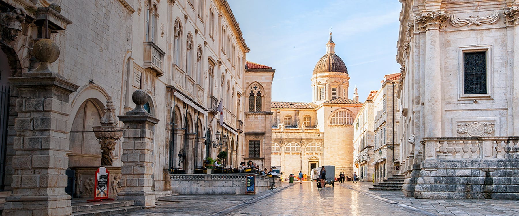 Historic street view with Dubrovnik Cathedral dome in Ragusa, Croatia.