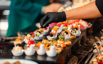 Canapés being prepared on a dolphin cruise.