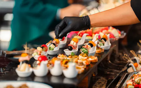 Canapés being prepared on a dolphin cruise.
