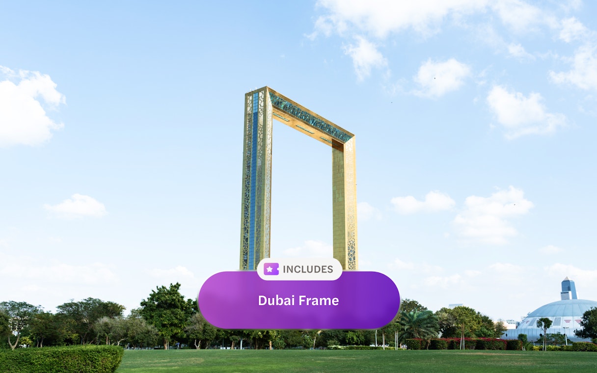 Dubai Frame in Zabeel Park under blue sky with clouds.