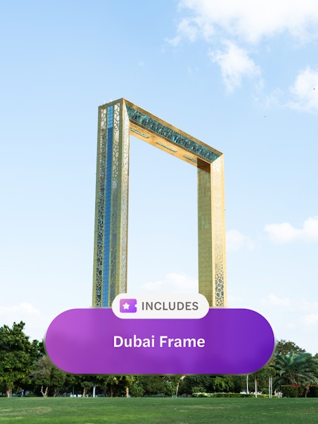 Dubai Frame in Zabeel Park under blue sky with clouds.