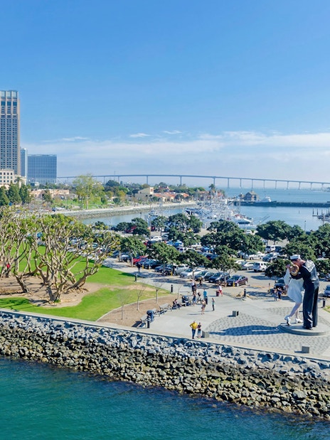 USS Midway Museum view with Unconditional Surrender statue in San Diego, California.