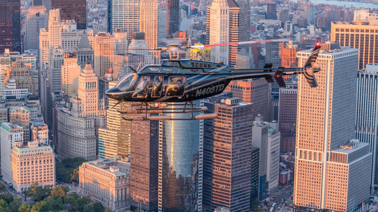 https://cdn-imgix.headout.com/media/images/24891f9f9ab6678f86cde9d1a6218fa9-HeliNY%20-%20Helicopter%20Battery%20Park%20Dusk%20NJ%20Tours.jpg