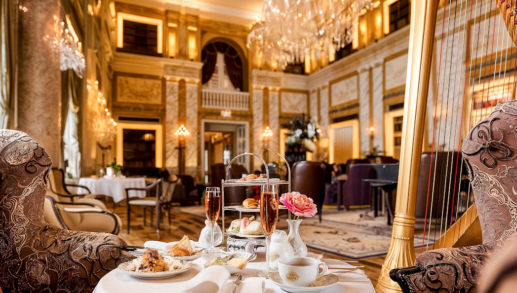 4-course meal setup at Restaurant Opus, Hotel Imperial, with elegant decor and harp.