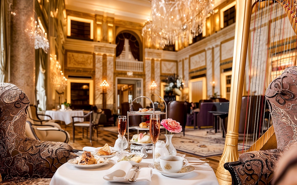 4-course meal setup at Restaurant Opus, Hotel Imperial, with elegant decor and harp.