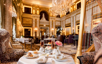 4-course meal setup at Restaurant Opus, Hotel Imperial, with elegant decor and harp.