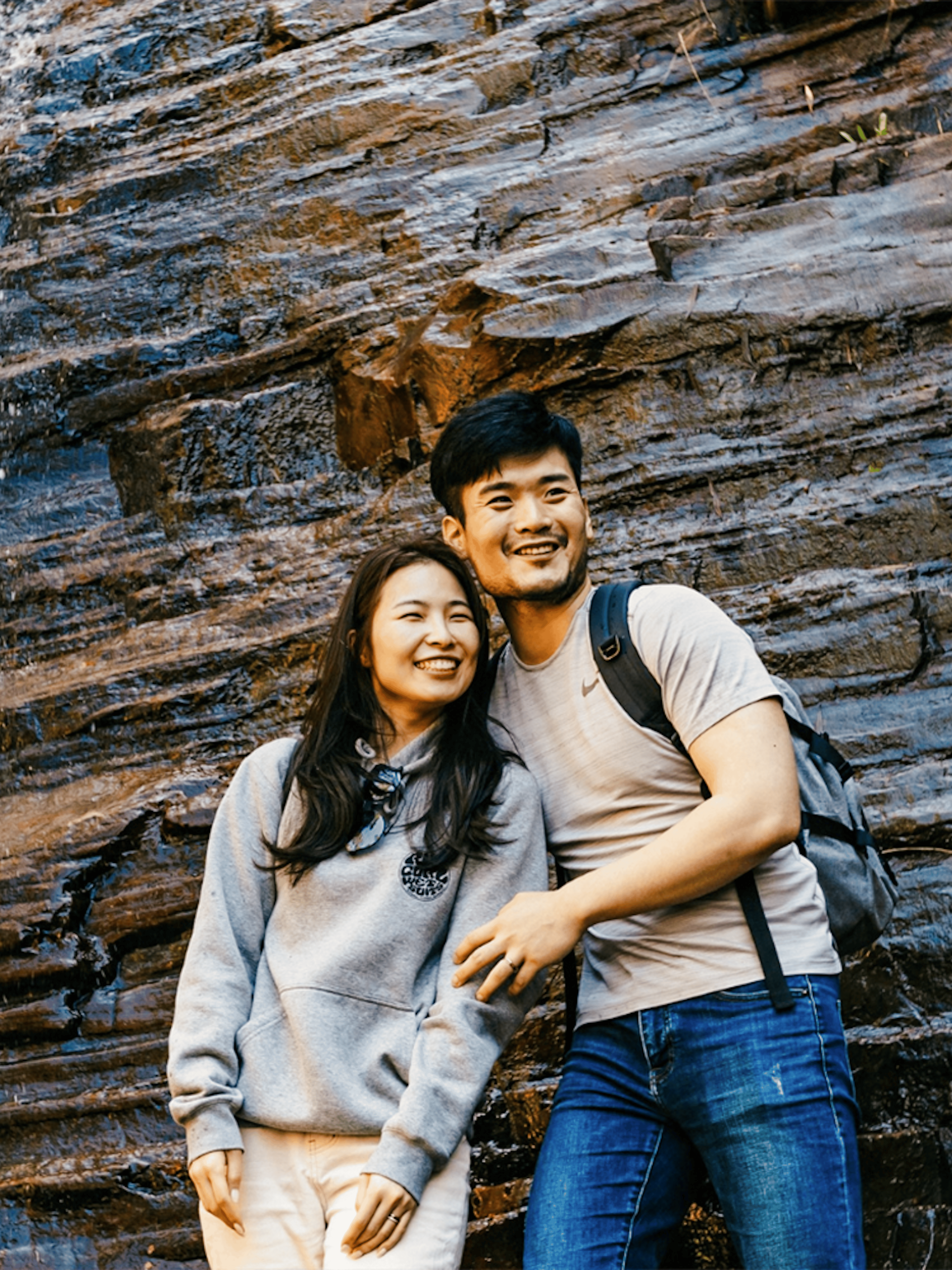 Couple smiling near Silverband Falls in Grampians National Park, Australia.