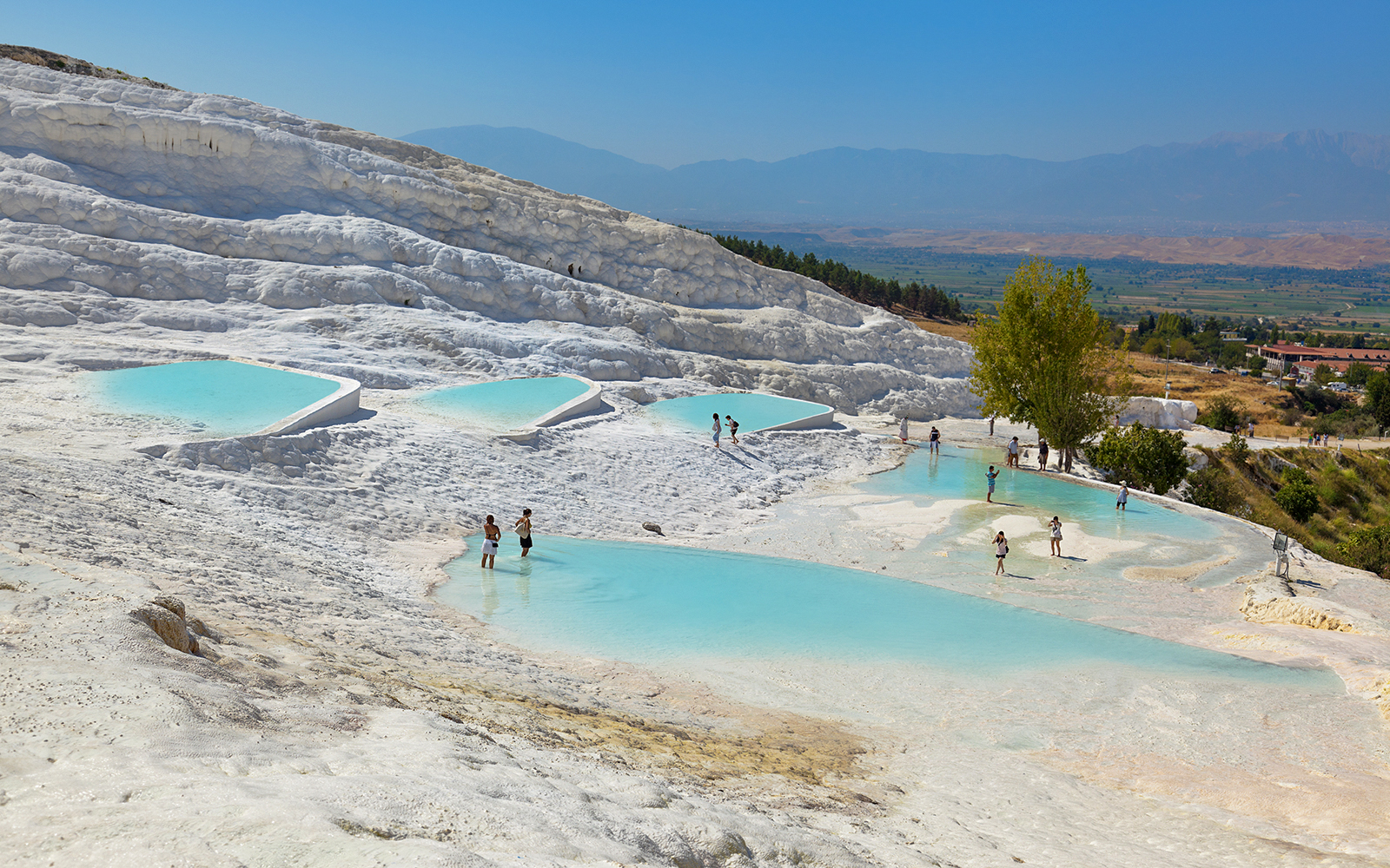 Guests enjoying thermal pools at Pamukkale, Turkey.