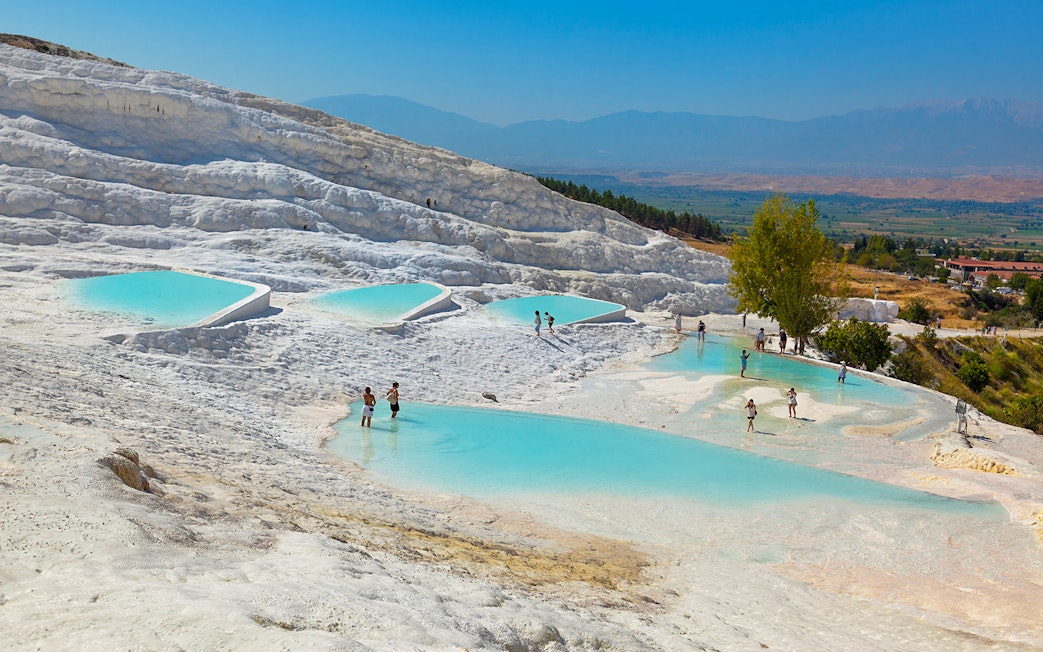 Guests enjoying thermal pools at Pamukkale, Turkey.