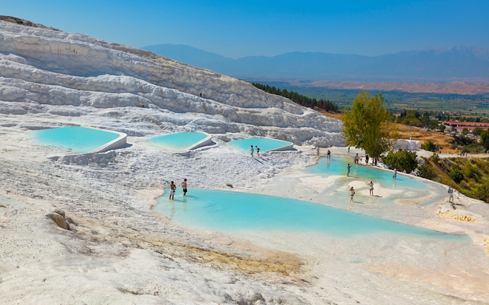Guests enjoying thermal pools at Pamukkale, Turkey.