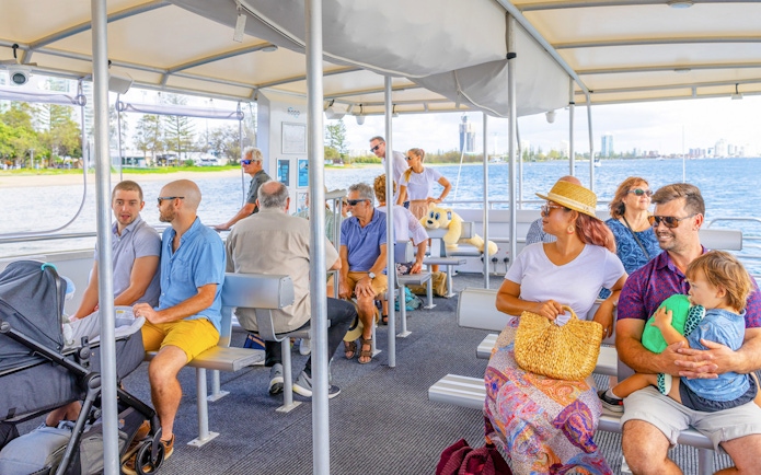 People enjoying a hop on hop off cruise on the Gold Coast, Australia.