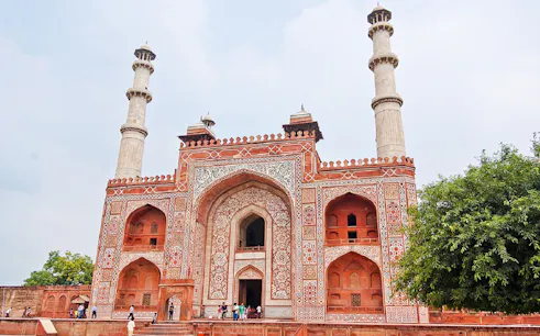 Akbar's Tomb entrance with intricate Mughal architecture, Agra Heritage Tour.