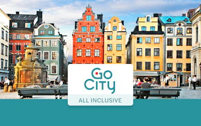 Colorful buildings in Stockholm's Gamla Stan with Go City All-Inclusive Pass sign.
