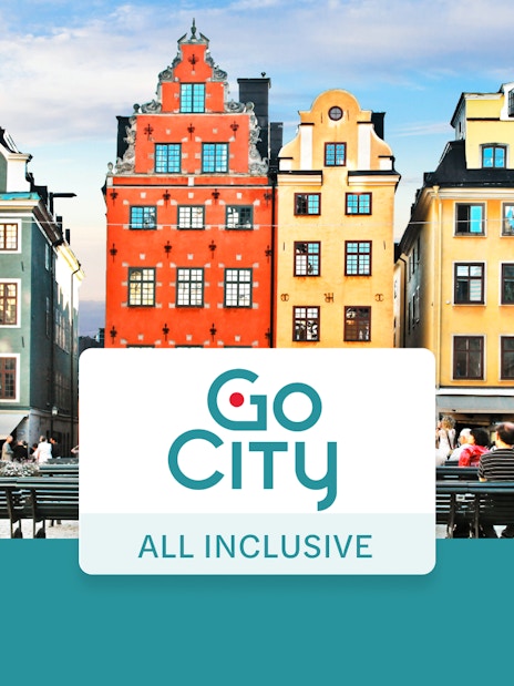 Colorful buildings in Stockholm's Gamla Stan with Go City All-Inclusive Pass sign.