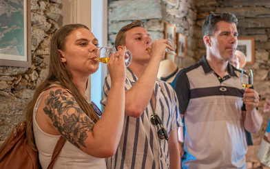 Tourists enjoying wine tasting in Douro Valley, Portugal.