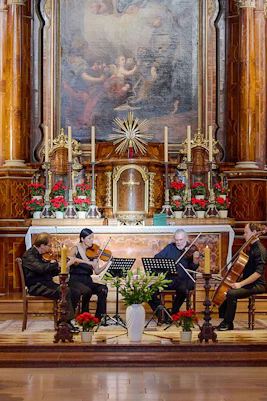 Musicians performing a classical concert inside Minoritenkirche, Vienna.