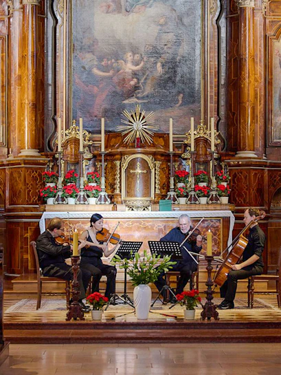 Musicians performing a classical concert inside Minoritenkirche, Vienna.