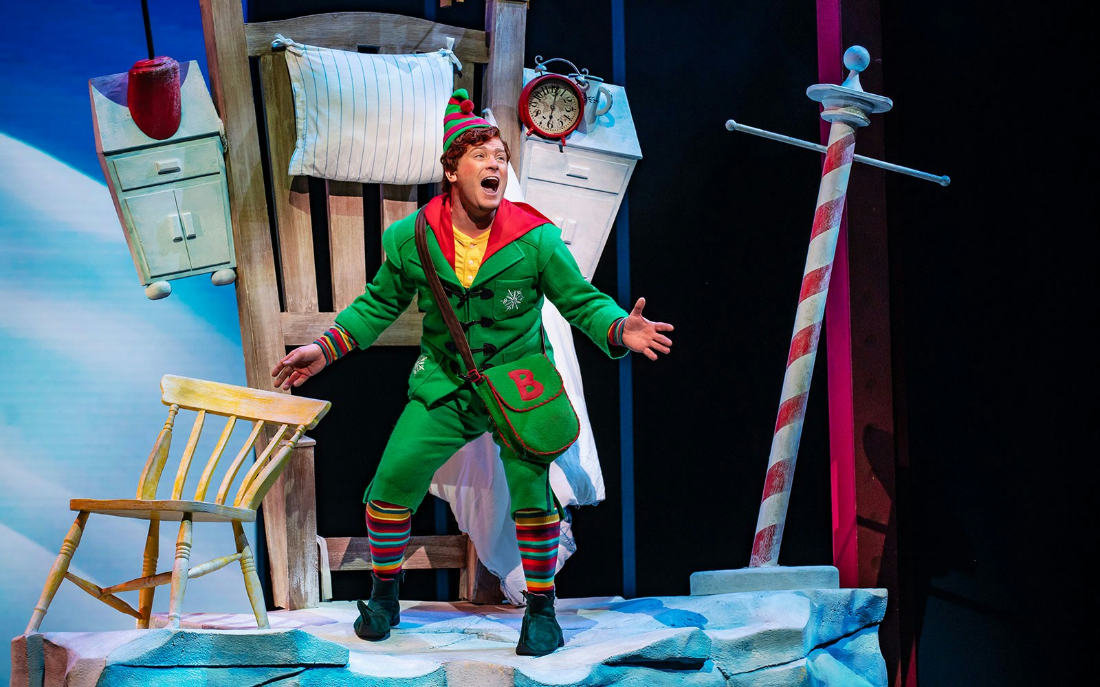 Elf The Musical stage performance with actors in festive costumes, New York City theater.