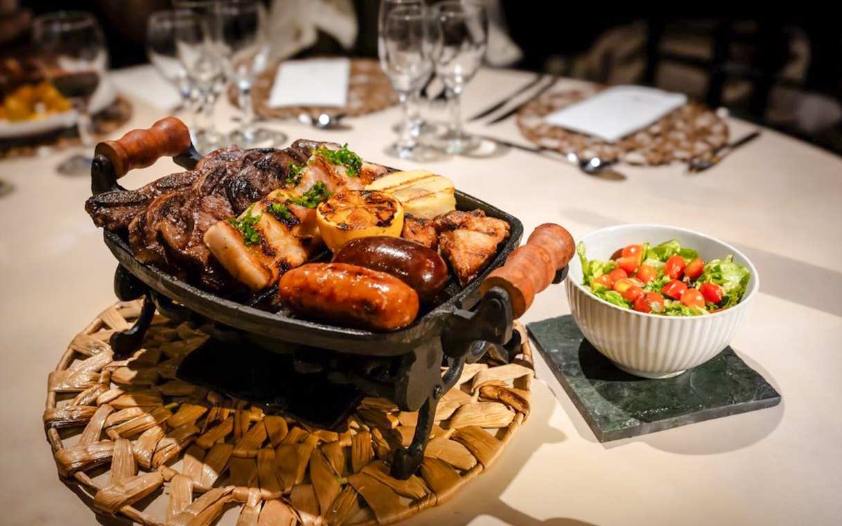 Grilled meats and salad served at Madero Tango Show in Buenos Aires.