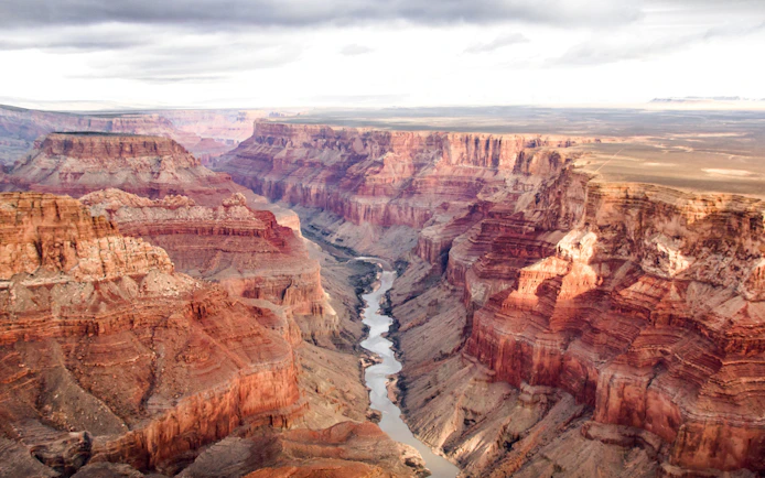Aerial view of the Grand Canyon's south and north rims with the Colorado River below.