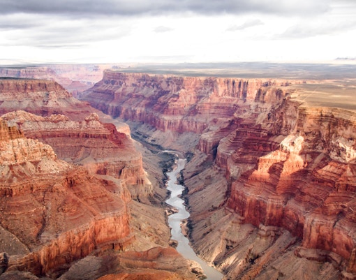 Aerial view of the Grand Canyon's south and north rims with the Colorado River below.