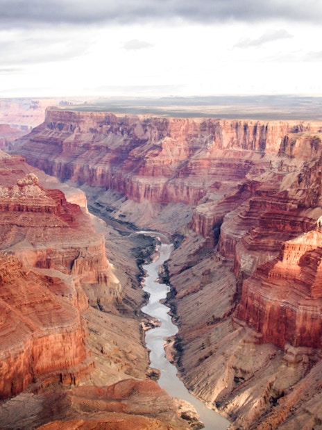 Aerial view of the Grand Canyon's south and north rims with the Colorado River below.