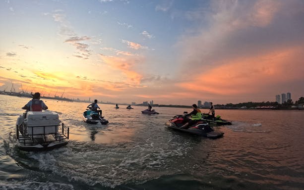 Jet skis on a Seadoo Safari at sunset in Johor Bahru waters.