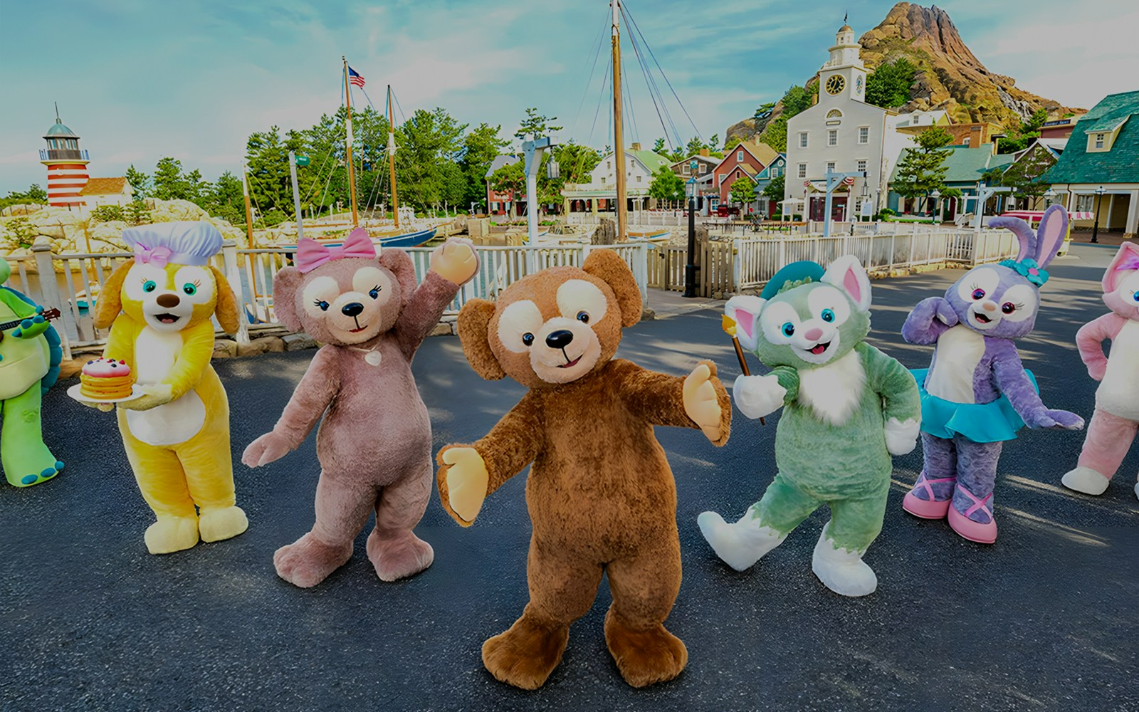 Characters at Tokyo Disneyland with Mount Prometheus in the background.