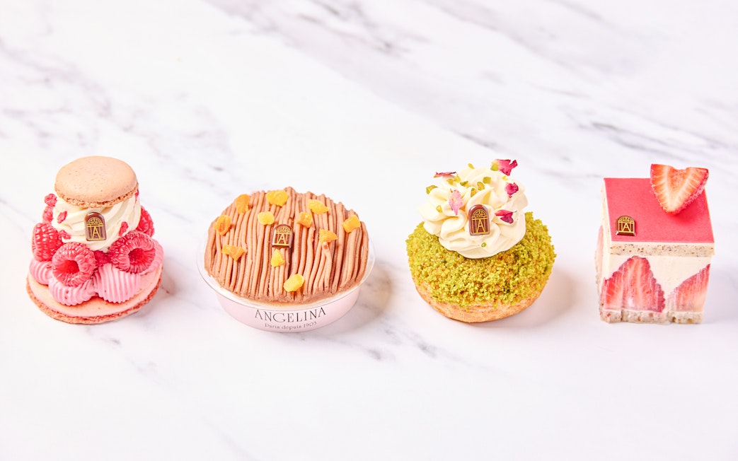 Selection of pastries at Angelina Rivoli, Paris, featuring macarons and fruit-topped desserts.