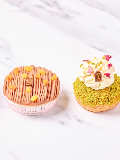 Selection of pastries at Angelina Rivoli, Paris, featuring macarons and fruit-topped desserts.