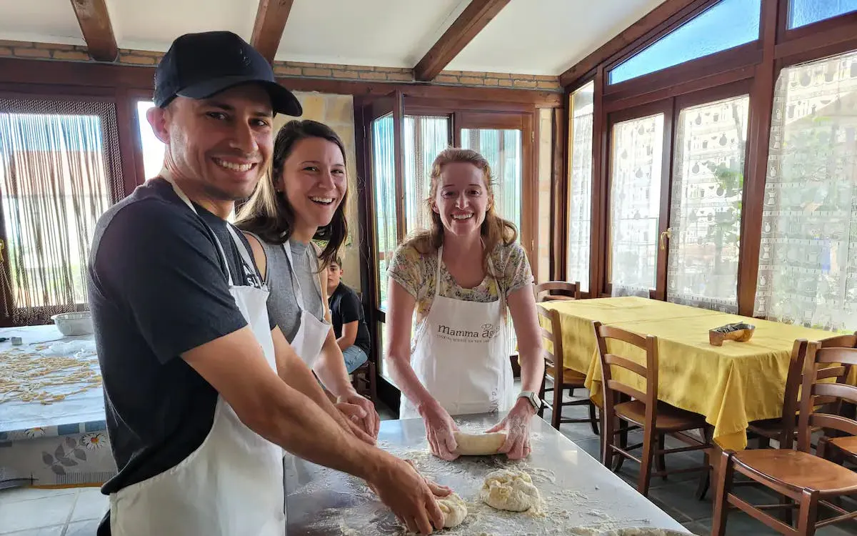 People making pasta dough during a cooking class at a farmhouse on the Amalfi Coast.