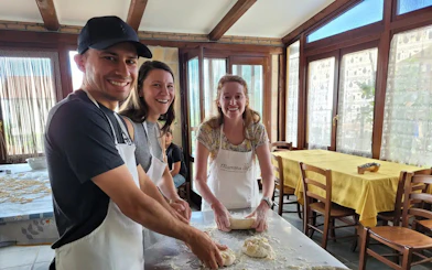 People making pasta dough during a cooking class at a farmhouse on the Amalfi Coast.