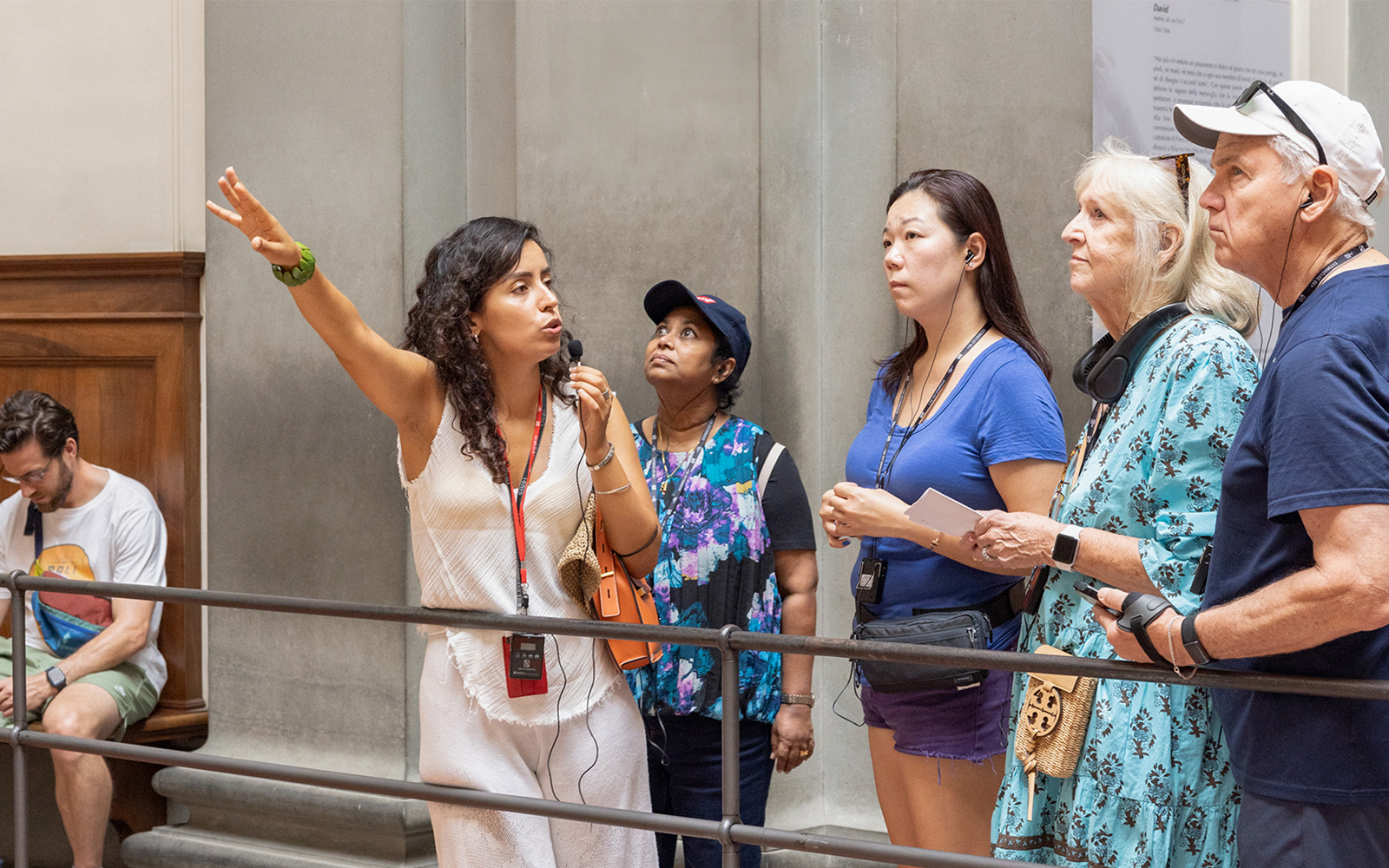 Tour group listening to guide inside liria palace