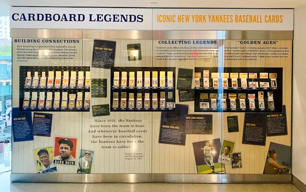 Yankees baseball card exhibit at Classic Stadium Tour featuring historic player cards.