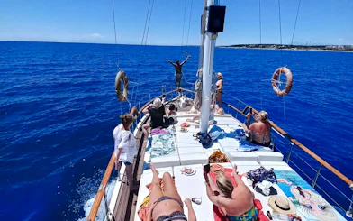 Private yacht rental with people sunbathing and enjoying the sea view, Antalya.