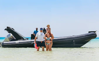 Family enjoying a private speedboat tour at Orange Bay, Giftun Island, Hurghada.