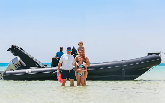 Family enjoying a private speedboat tour at Orange Bay, Giftun Island, Hurghada.