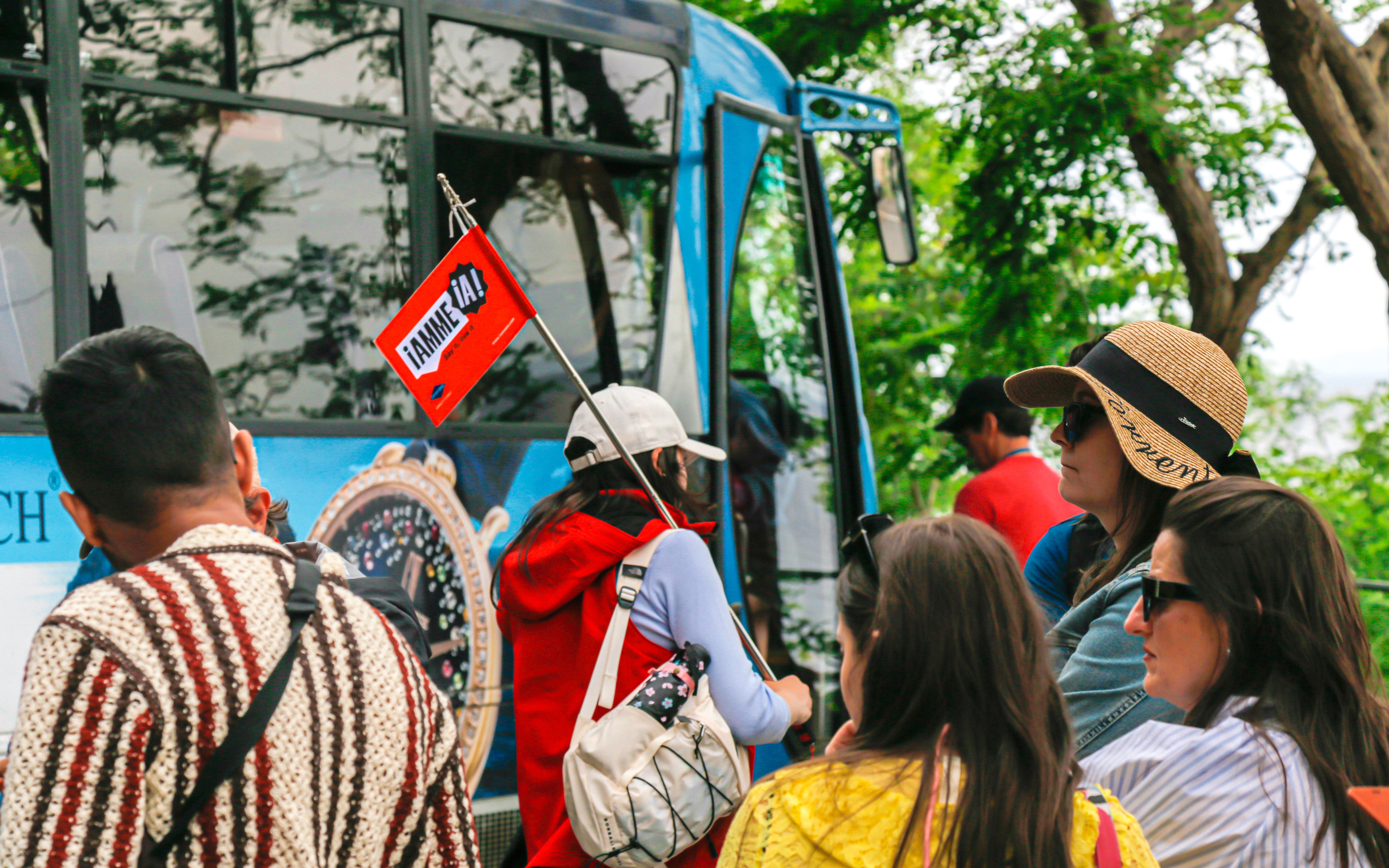 Tourists boarding bus for Capri and Anacapri guided tour with Blue Grotto visit from Sorrento.