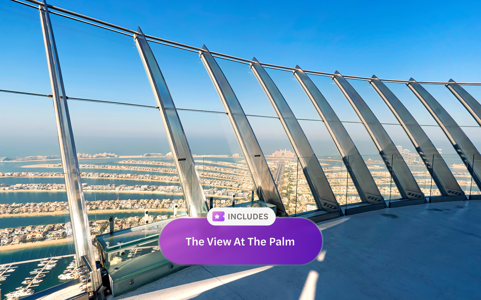 Observation deck view of Palm Jumeirah, Dubai, with ocean and skyline in the background.