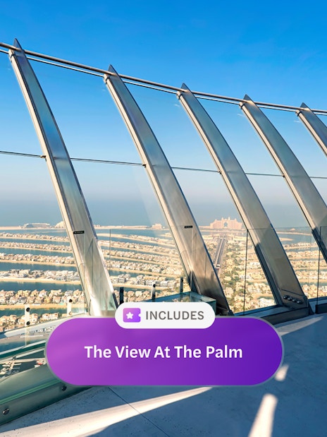 Observation deck view of Palm Jumeirah, Dubai, with ocean and skyline in the background.